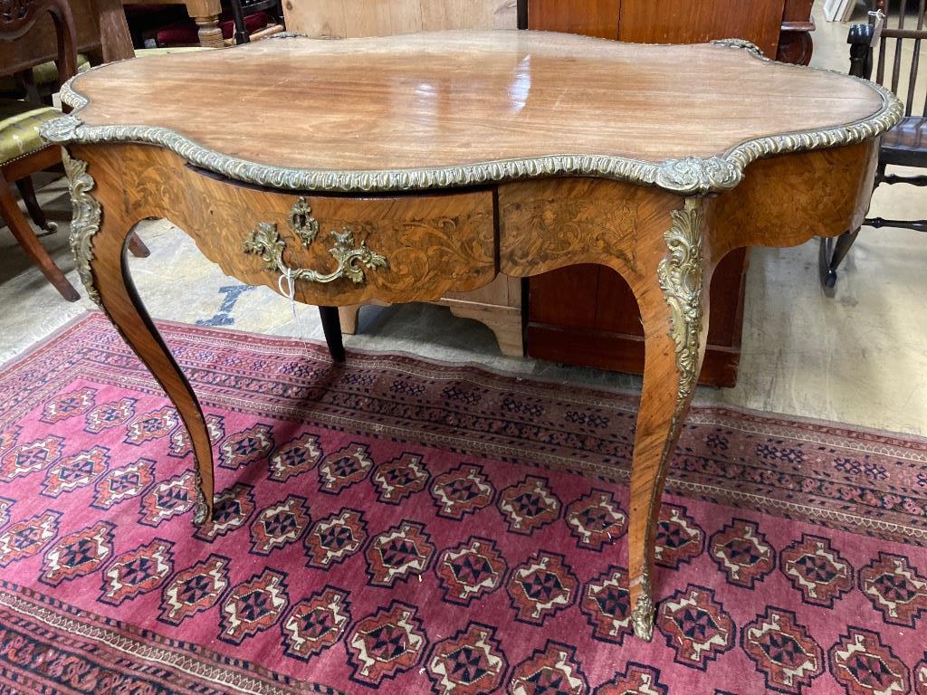 A 19th century French marquetry and kingwood centre table, (having later walnut-veneered top) width 124cm, depth 78cm, height 74cm